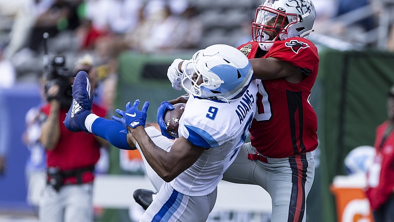 Apr 24, 2022; Birmingham, AL, USA; New Orleans Breakers wide receiver Jonathan Adams (9) catches the ball with Tampa Bay Bandits defensive back Quenton Meeks (30) on tight defense during the first half at Protective Stadium. Mandatory Credit: Vasha Hunt-USA TODAY Sports
