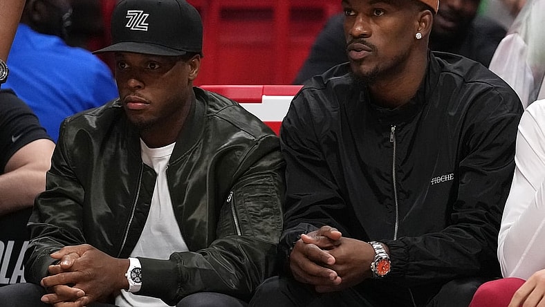 Apr 26, 2022; Miami, Florida, USA; Miami Heat guard Kyle Lowry (L) and Miami Heat forward Jimmy Butler (R) sit on the bench during the first half in game five of the first round for the 2022 NBA playoffs against the Atlanta Hawks at FTX Arena. Mandatory Credit: Jasen Vinlove-USA TODAY Sports