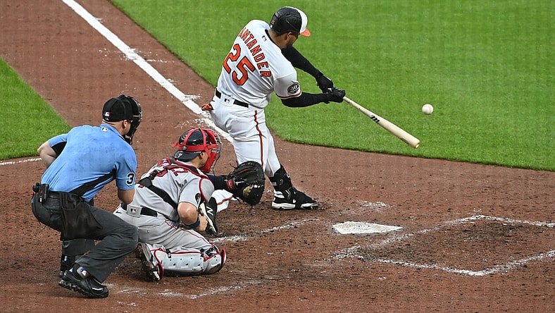 May 1, 2022; Baltimore, Maryland, USA; Baltimore Orioles right fielder Anthony Santander (25) hits a sacrifice single scoring first baseman Tyler Nevin (not pictured) during the fifth inning  at Oriole Park at Camden Yards. Mandatory Credit: Tommy Gilligan-USA TODAY Sports