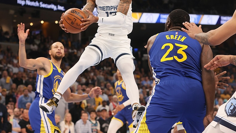 May 1, 2022; Memphis, Tennessee, USA; Memphis Grizzlies guard Ja Morant (12) attempts a layup against the Golden State Warriors during Game 1 of the second round for the 2022 NBA playoffs at FedExForum. Mandatory Credit: Joe Rondone-USA TODAY Sports