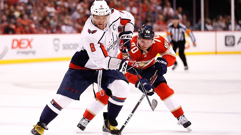 May 3, 2022; Sunrise, Florida, USA; Washington Capitals left wing Alex Ovechkin (8) moves the puck ahead of Florida Panthers right wing Patric Hornqvist (70) during the first period in game one of the first round of the 2022 Stanley Cup Playoffs at FLA Live Arena. Mandatory Credit: Sam Navarro-USA TODAY Sports