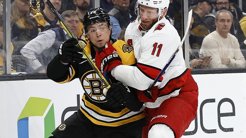 May 6, 2022; Boston, Massachusetts, USA; Carolina Hurricanes center Jordan Staal (11) collides with Boston Bruins defenseman Charlie McAvoy (73) during the first period in game three of the first round of the 2022 Stanley Cup Playoffs at TD Garden. Mandatory Credit: Winslow Townson-USA TODAY Sports