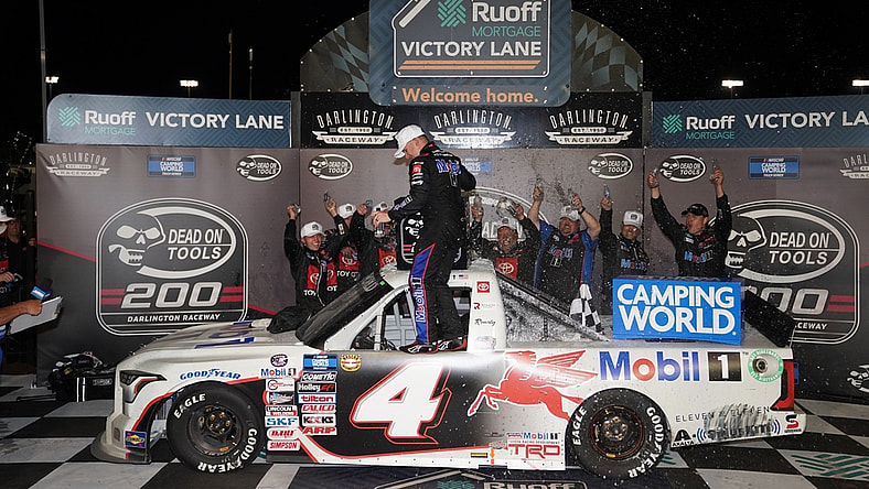 May 6, 2022; Darlington, South Carolina, USA; NASCAR Truck Series driver John Hunter Nemechek (4) celebrates winning the Dead On Tools 200 at Darlington Raceway. Mandatory Credit: Jasen Vinlove-USA TODAY Sports