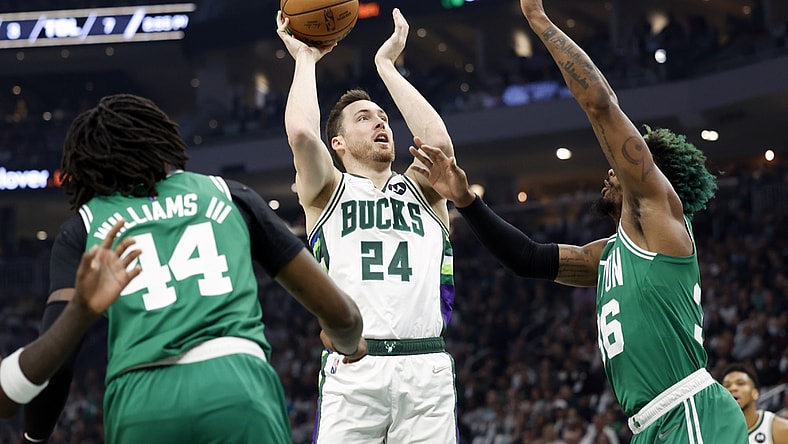 May 7, 2022; Milwaukee, Wisconsin, USA; Milwaukee Bucks guard Pat Connaughton (24) shoots against Boston Celtics guard Marcus Smart (36) during the first quarter during game three of the second round for the 2022 NBA playoffs at Fiserv Forum. Mandatory Credit: Jeff Hanisch-USA TODAY Sports