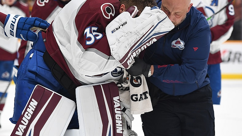 May 7, 2022; Nashville, Tennessee, USA; Colorado Avalanche goaltender Darcy Kuemper (35) is helped off the ice after an injury during the first period against the Nashville Predators in game three of the first round of the 2022 Stanley Cup Playoffs at Bridgestone Arena. Mandatory Credit: Christopher Hanewinckel-USA TODAY Sports