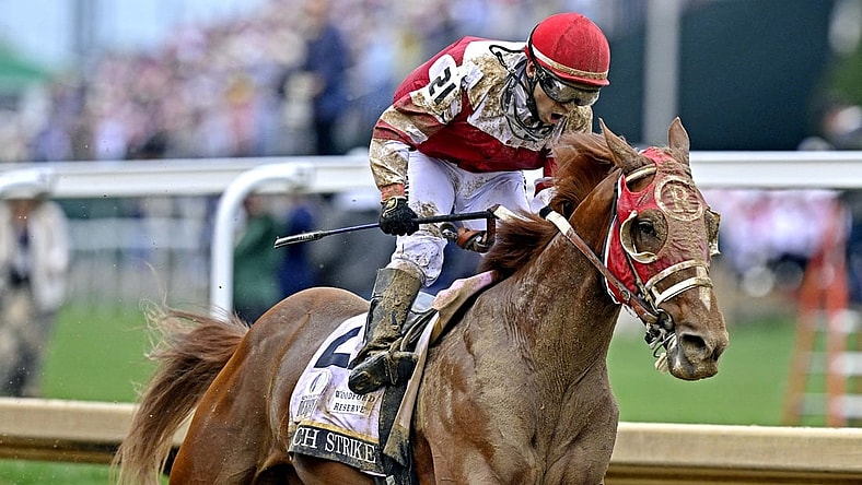 May 7, 2022; Louisville, KY, USA; Sonny Leon aboard Rich Strike celebrates winning the 148th running of the Kentucky Derby at Churchill Downs. Mandatory Credit: Jamie Rhodes-USA TODAY Sports