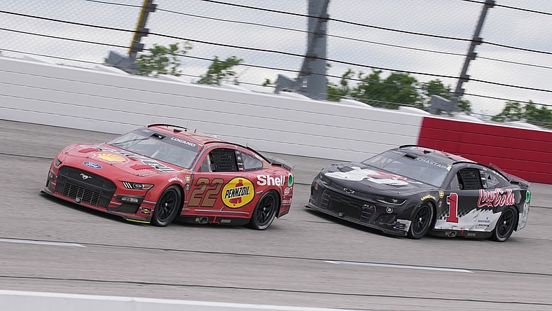 May 8, 2022; Darlington, South Carolina, USA; NASCAR Cup Series driver Joey Logano (22) races NASCAR Cup Series driver Ross Chastain (1) during the Goodyear 400 at Darlington Raceway. Mandatory Credit: Jasen Vinlove-USA TODAY Sports