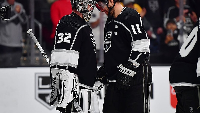 May 8, 2022; Los Angeles, California, USA; Los Angeles Kings goaltender Jonathan Quick (32) and center Anze Kopitar (11) celebrate the victory against the Edmonton Oilers following game four of the first round of the 2022 Stanley Cup Playoffs at Crypto.com Arena. Mandatory Credit: Gary A. Vasquez-USA TODAY Sports