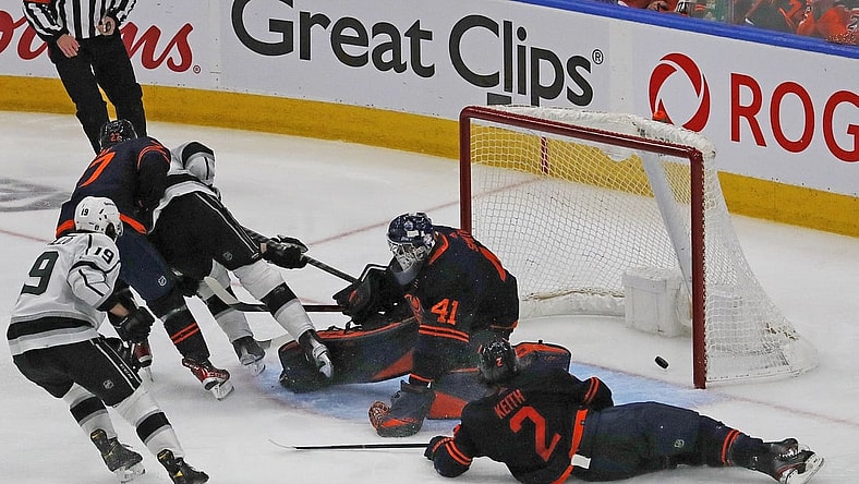 May 10, 2022; Edmonton, Alberta, CAN; Los Angeles Kings forward Adrian Kempe (9) scores the over-time winning gaol against Edmonton Oilers goaltender Mike Smith (41) in game five of the first round of the 2022 Stanley Cup Playoffs at Rogers Place. Mandatory Credit: Perry Nelson-USA TODAY Sports