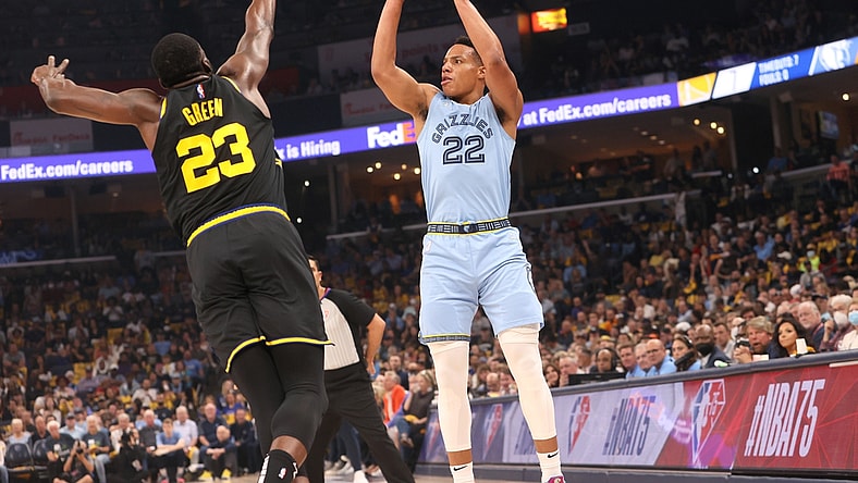 May 11, 2022; Memphis, Tennessee, USA; Memphis Grizzlies guard Desmond Bane (22) shoots the ball over Golden State Warriors forward Draymond Green (23) during game five of the second round for the 2022 NBA playoffs at FedExForum. Mandatory Credit: Joe Rondone-USA TODAY Sports