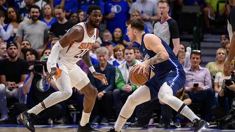 May 12, 2022; Dallas, Texas, USA; Phoenix Suns center Deandre Ayton (22) guards Dallas Mavericks guard Luka Doncic (77) during the first quarter during game six of the second round of the 2022 NBA playoffs at the American Airlines Center. Mandatory Credit: Jerome Miron-USA TODAY Sports