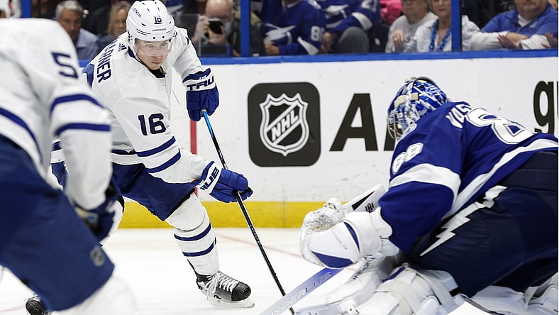 May 12, 2022; Tampa, Florida, USA; Toronto Maple Leafs right wing Mitchell Marner (16) skates with the puck as Tampa Bay Lightning goaltender Andrei Vasilevskiy (88) defends during overtime of game six of the first round of the 2022 Stanley Cup Playoffs at Amalie Arena. Mandatory Credit: Kim Klement-USA TODAY Sports