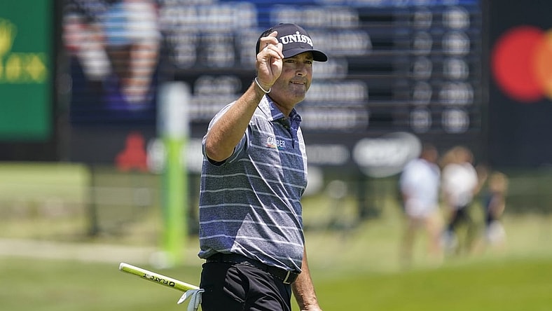 May 13, 2022; McKinney, Texas, USA; Ryan Palmer waves to the gallery as he walks off the ninth green after shooting a 10-under 62 during the second round of the AT&T Byron Nelson golf tournament. Mandatory Credit: Raymond Carlin III-USA TODAY Sports