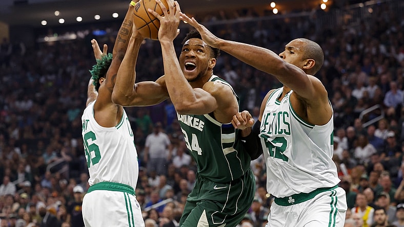 May 13, 2022; Milwaukee, Wisconsin, USA;  Milwaukee Bucks forward Giannis Antetokounmpo (34) drives for the basket between Boston Celtics guard Marcus Smart (36) and forward Al Horford (42) during the first quarter during game six of the second round for the 2022 NBA playoffs at Fiserv Forum. Mandatory Credit: Jeff Hanisch-USA TODAY Sports