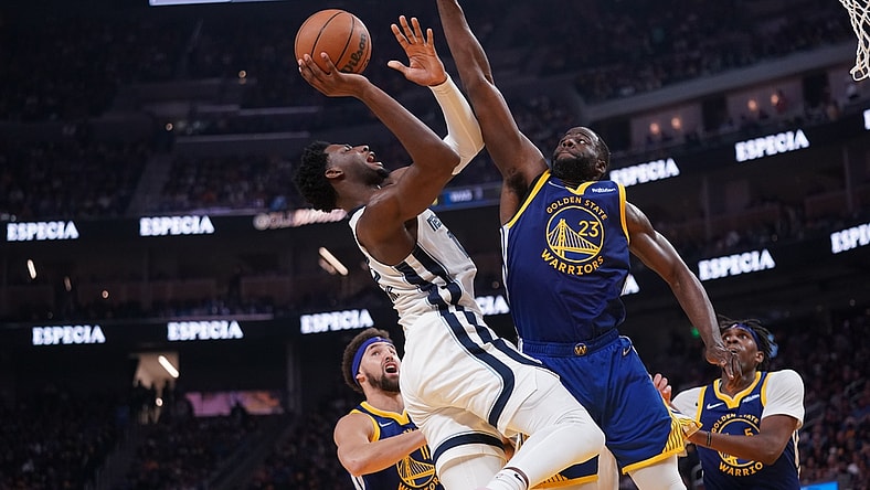 May 13, 2022; San Francisco, California, USA; Memphis Grizzlies forward Jaren Jackson Jr. (13) makes a shot next to Golden State Warriors forward Draymond Green (23) in the second quarter during game six of the second round for the 2022 NBA playoffs at Chase Center. Mandatory Credit: Cary Edmondson-USA TODAY Sports