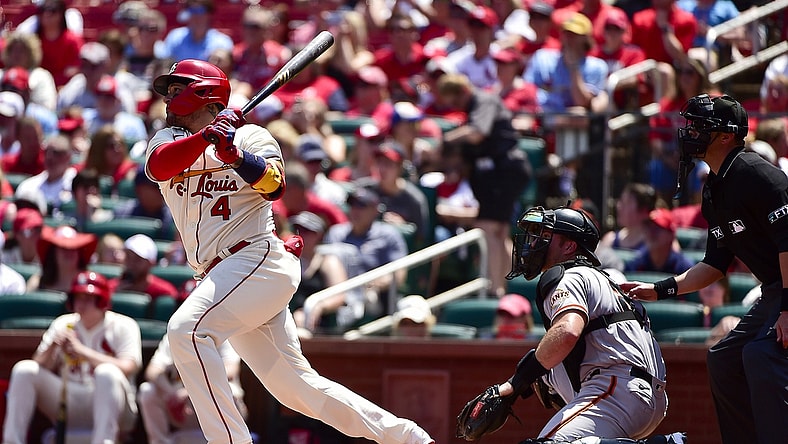 St. Louis Cardinals catcher Yadier Molina (4) hits a double against the San Francisco Giants during the second inning at Busch Stadium. Mandatory Credit: Jeff Curry-USA TODAY Sports