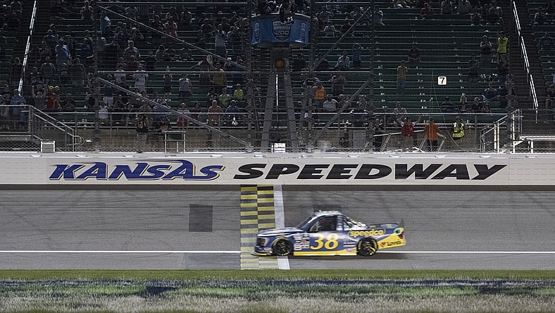 May 14, 2022; Kansas City, Kansas, USA; NASCAR Truck Series driver Zane Smith (38) crosses the finish line to win the Truck Series Heart of America 200 at Kansas Speedway. Mandatory Credit: Amy Kontras-USA TODAY Sports