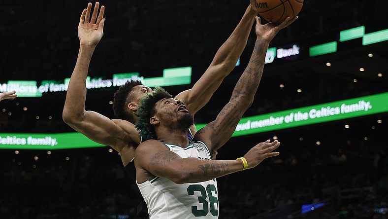 May 15, 2022; Boston, Massachusetts, USA; Milwaukee Bucks forward Giannis Antetokounmpo (34) comes from behind to block a shot by Boston Celtics guard Marcus Smart (36) during the second quarter of game seven of the second round of the 2022 NBA playoffs at TD Garden. Mandatory Credit: Winslow Townson-USA TODAY Sports