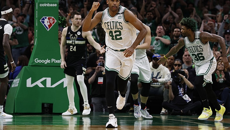 May 15, 2022; Boston, Massachusetts, USA; Boston Celtics center Al Horford (42) pumps his fist as he heads back up court after hitting a basket against the Milwaukee Bucks during the second half of game seven of the second round of the 2022 NBA playoffs at TD Garden. Mandatory Credit: Winslow Townson-USA TODAY Sports