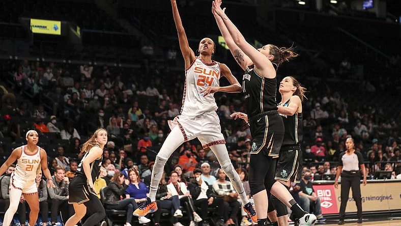 May 17, 2022; Brooklyn, New York, USA;  Connecticut Sun forward DeWanna Bonner (24) moves past New York Liberty center Stefanie Dolson (31) in the third quarter at Barclays Center. Mandatory Credit: Wendell Cruz-USA TODAY Sports