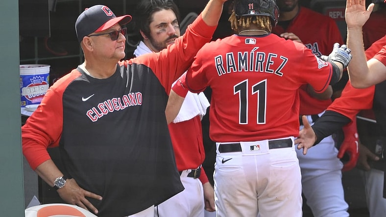 May 19, 2022; Cleveland, Ohio, USA; Cleveland Guardians third baseman Jose Ramirez (11) celebrates his RBI single with manager Terry Francona (77) in the eighth inning against the Cincinnati Reds at Progressive Field. Mandatory Credit: David Richard-USA TODAY Sports