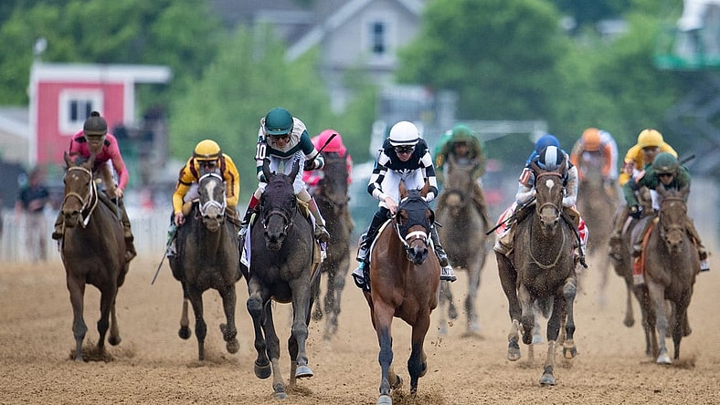 May 20, 2022; Baltimore, MD, USA; Florent Group aboard Interstatedaydream (back and white) wins the running of the Black-Eyed Susan Day at Pimlico Race Course. Mandatory Credit: Tommy Gilligan-USA TODAY Sports