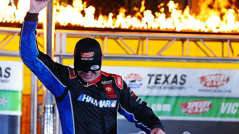 May 20, 2022; Fort Worth, Texas, USA; Camping World Truck Series driver Stewart Friesen (52) celebrates in victory lane after winning the SpeedyCash.com 220 at Texas Motor Speedway. Mandatory Credit: John David Mercer-USA TODAY Sports