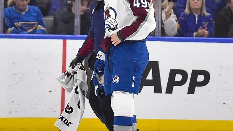 May 21, 2022; St. Louis, Missouri, USA; Colorado Avalanche defenseman Samuel Girard (49) is helped off the ice by a trainer after a hit by the St. Louis Blues during the first period in game three of the second round of the 2022 Stanley Cup Playoffs at Enterprise Center. Mandatory Credit: Jeff Curry-USA TODAY Sports