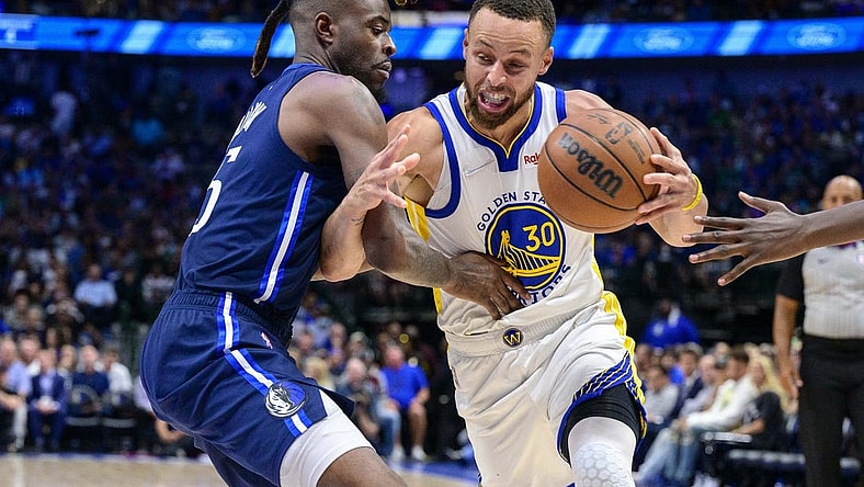 May 22, 2022; Dallas, Texas, USA; Golden State Warriors guard Stephen Curry (30) is fouled by Dallas Mavericks forward Reggie Bullock (25) during the third quarter in game three of the 2022 western conference finals at American Airlines Center. Mandatory Credit: Jerome Miron-USA TODAY Sports