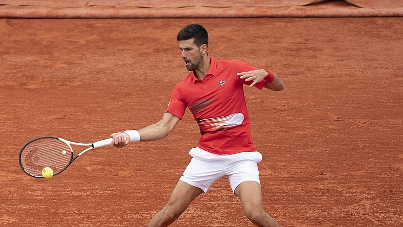 May 25, 2022; Paris, France; Novak Djokovic (SRB) returns a shot from Alex Molten (SVK) during their match on day four of the French Open at Stade Roland-Garros. Mandatory Credit: Susan Mullane-USA TODAY Sports
