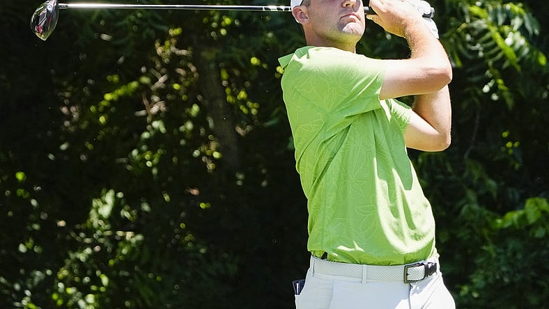 May 26, 2022; Fort Worth, Texas, USA; Scottie Scheffler plays his shot from the sixth tee during the first round of the Charles Schwab Challenge golf tournament. Mandatory Credit: Jim Cowsert-USA TODAY Sports