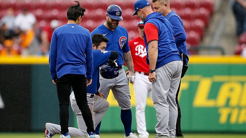 Chicago Cubs right fielder Seiya Suzuki (27) is checked by medical staff after sliding into second base in the third inning of the MLB National League game between the Cincinnati Reds and the Chicago Cubs at Great American Ball Park in downtown Cincinnati on Thursday, May 26, 2022. The Reds led 10-3 after three innings.
Chicago Cubs At Cincinnati Reds