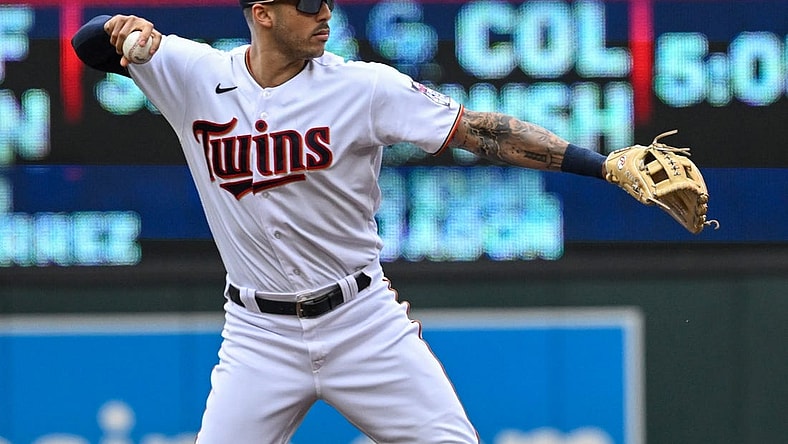 May 28, 2022; Minneapolis, Minnesota, USA;  Minnesota Twins shortstop Carlos Correa (4) throws to first base for a force out against the Kansas City Royals during the first inning at Target Field. Mandatory Credit: Nick Wosika-USA TODAY Sports