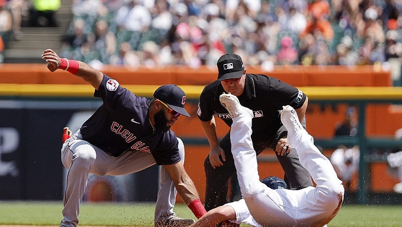 May 29, 2022; Detroit, Michigan, USA; Cleveland Guardians shortstop Amed Rosario (1) tags Detroit Tigers first baseman Spencer Torkelson (20) out trying to steal second in the second inning at Comerica Park. Mandatory Credit: Rick Osentoski-USA TODAY Sports