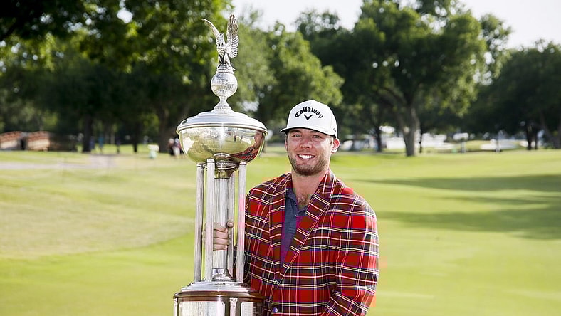 May 29, 2022; Fort Worth, Texas, USA; Sam Burns holds the winners trophy after winning the Charles Schwab Challenge golf tournament in a playoff over Scottie Scheffler. Mandatory Credit: Raymond Carlin III-USA TODAY Sports