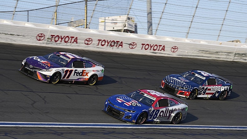 May 29, 2022; Concord, North Carolina, USA; NASCAR Cup Series driver Denny Hamlin (11) races NASCAR Cup Series driver Alex Bowman (48) and NASCAR Cup Series driver William Byron (24) during the Coca-Cola 600 at Charlotte Motor Speedway. Mandatory Credit: Jasen Vinlove-USA TODAY Sports