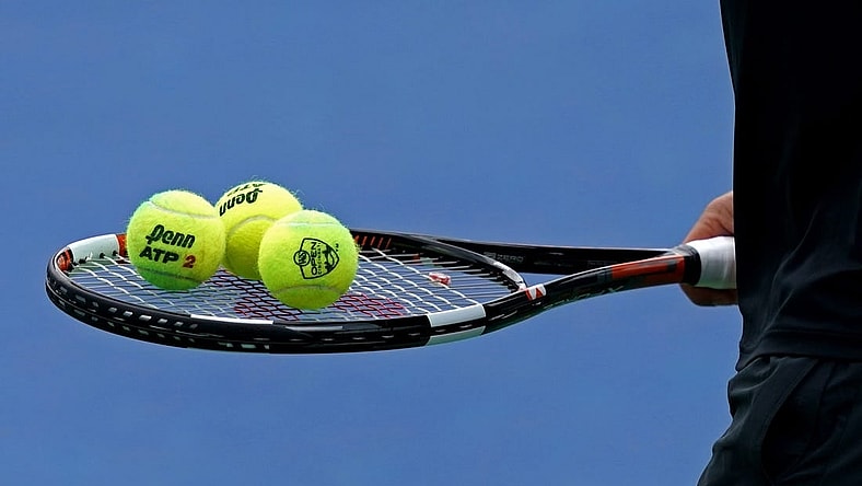Aug 11, 2018; Mason, OH, USA; A view of the Penn tennis balls on the racket of Marcos Baghdatis (CYP) as he prepares to serve against Feliciano Lopez (ESP) in the Western and Southern tennis open at Lindner Family Tennis Center. Mandatory Credit: Aaron Doster-USA TODAY Sports
