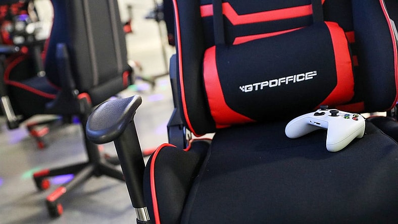 A gaming chair and controller are seen during an Evolve Youth Sports practice at the Player One arena in Carmel, Ind., Thursday, Jan. 24, 2019. Scott Wise, original founder of Scotty's Brewhouse, has partnered with Player One Esports for his next venture, a video game sports league that has attracted around 200 kids so far.

Evolve Youth Esports At Player One Arena In Carmel Ind Opened By Scott Wise Former Founder Of Scotty S Brewhouse Jan 24 2019