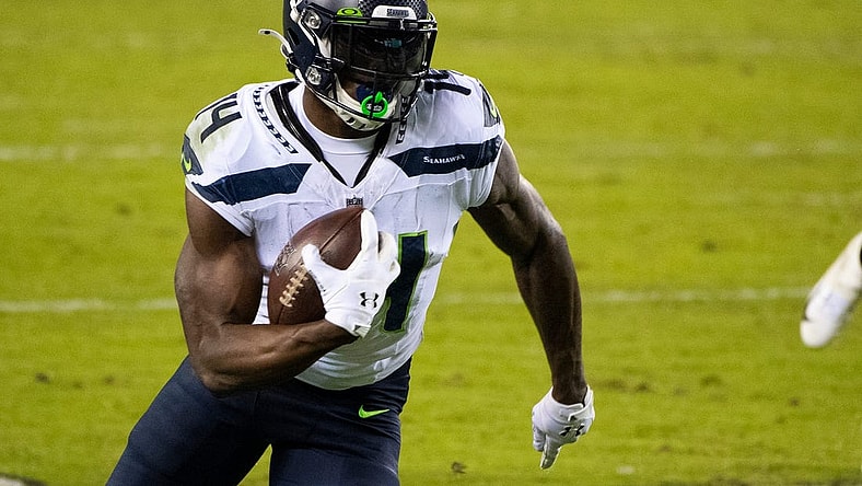Seahawks' D.K. Metcalf (14) carries the ball against the Eagles Monday, Nov. 30, 2020 in Philadelphia.

Jl Eagles 113020 23