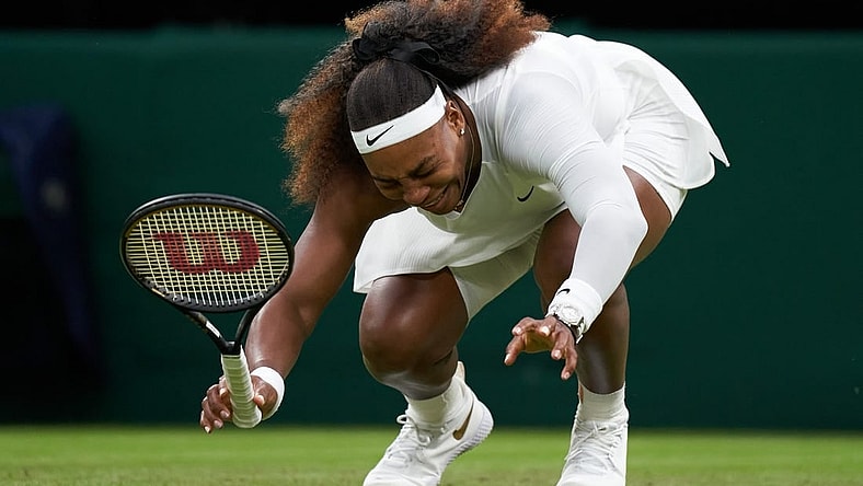 Jun 29, 2021; London, United Kingdom;  Serena Williams (USA) falls to the court while playing Aliaksandra Sasnovich (BLR) in first round ladies singles on centre court at All England Lawn Tennis and Croquet Club.  Mandatory Credit: Peter Van den Berg-USA TODAY Sports