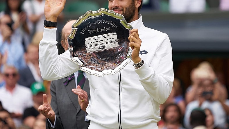 Jul 11, 2021; London, United Kingdom; Matteo Berrettini (ITA) with the runner-up trophy on Centre Court at All England Lawn Tennis and Croquet Club. Mandatory Credit: Peter van den Berg-USA TODAY Sports