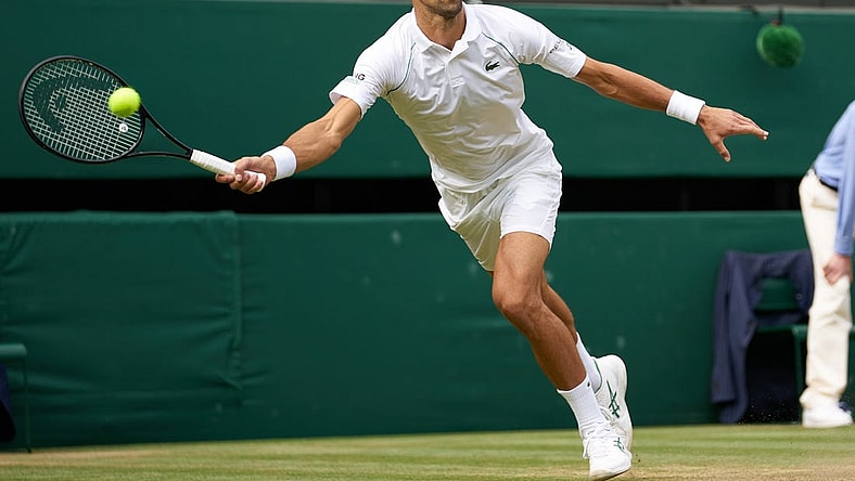 Jul 11, 2021; London, United Kingdom; Novak Djokovic (SRB) plays against Matteo Berrettini (ITA) in the men s final on Centre Court at All England Lawn Tennis and Croquet Club. Mandatory Credit: Peter van den Berg-USA TODAY Sports