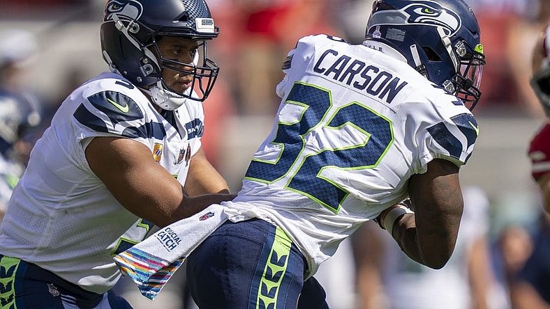 October 3, 2021; Santa Clara, California, USA; Seattle Seahawks quarterback Russell Wilson (3) hands the football off to running back Chris Carson (32) against the San Francisco 49ers during the first quarter at Levi's Stadium. Mandatory Credit: Kyle Terada-USA TODAY Sports