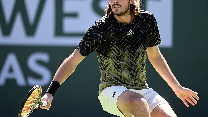Oct 15, 2021; Indian Wells, CA, USA;   Stefanos Tsitsipas (GRE)hits a shot during his quarter final match against Nikoloz Basilashvili (GEO) during the BNP Paribas Open at the Indian Wells Tennis Garden. Mandatory Credit: Jayne Kamin-Oncea-USA TODAY Sports