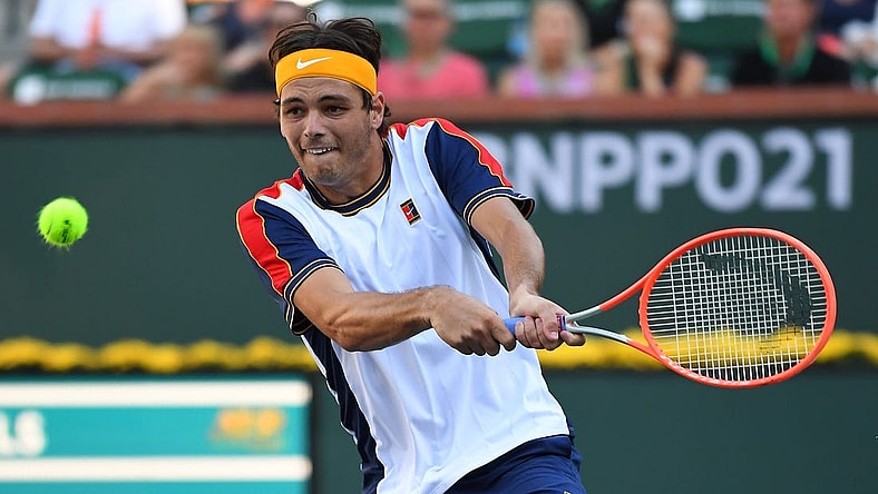 Oct 16, 2021; Indian Wells, CA, USA;  Taylor Fritz (USA) hits a shot in his semifinal match against Nikoloz Basilashvili (GEO) at the BNP Paribas Open at the Indian Wells Tennis Garden. Mandatory Credit: Jayne Kamin-Oncea-USA TODAY Sports