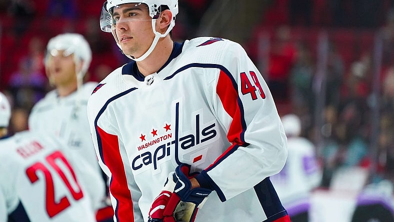 Nov 28, 2021; Raleigh, North Carolina, USA;  Washington Capitals right wing Brett Leason (49) looks on before the game against the Carolina Hurricanes at PNC Arena. Mandatory Credit: James Guillory-USA TODAY Sports