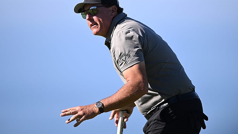 Jan 27, 2022; San Diego, California, USA; Phil Mickelson acknowledges the crowd after a putt on the fourth green during the first round of the Farmers Insurance Open golf tournament at Torrey Pines Municipal Golf Course - South Course. Mandatory Credit: Orlando Ramirez-USA TODAY Sports
