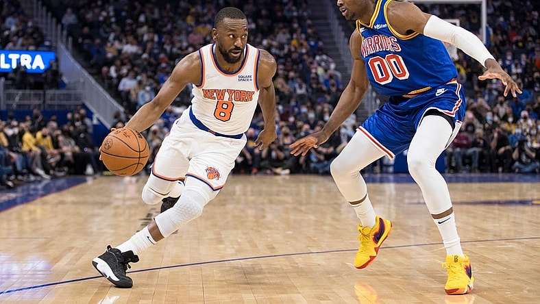 Feb 10, 2022; San Francisco, California, USA; New York Knicks guard Kemba Walker (8) dribbles past Golden State Warriors forward Jonathan Kuminga (00) during the first half at Chase Center. Mandatory Credit: John Hefti-USA TODAY Sports