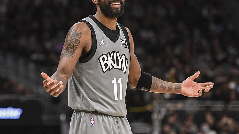 Feb 26, 2022; Milwaukee, Wisconsin, USA; Brooklyn Nets guard Kyrie Irving (11) reacts in the fourth quarter against the Milwaukee Bucks at Fiserv Forum. Mandatory Credit: Benny Sieu-USA TODAY Sports