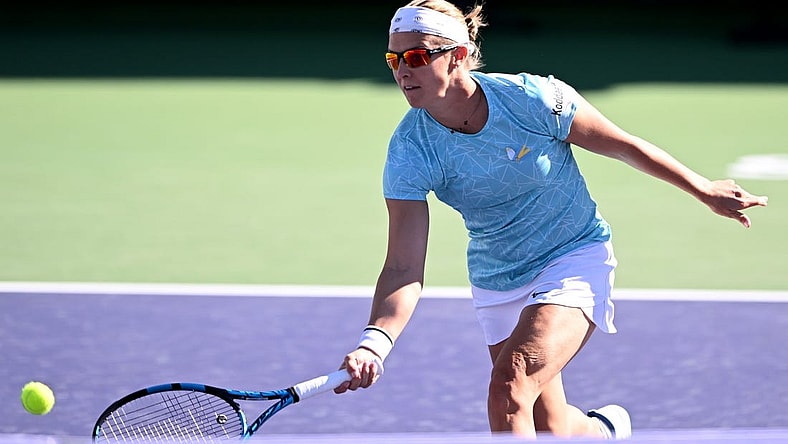 Mar 8, 2022; Indian Wells, CA, USA;  Kirsten Flipkens (BEL) hits a shot during her match against Catherine McNally (USA) at the BNP Paribas Open at Indian Wells Tennis Garden. Mandatory Credit: Jayne Kamin-Oncea-USA TODAY Sports
